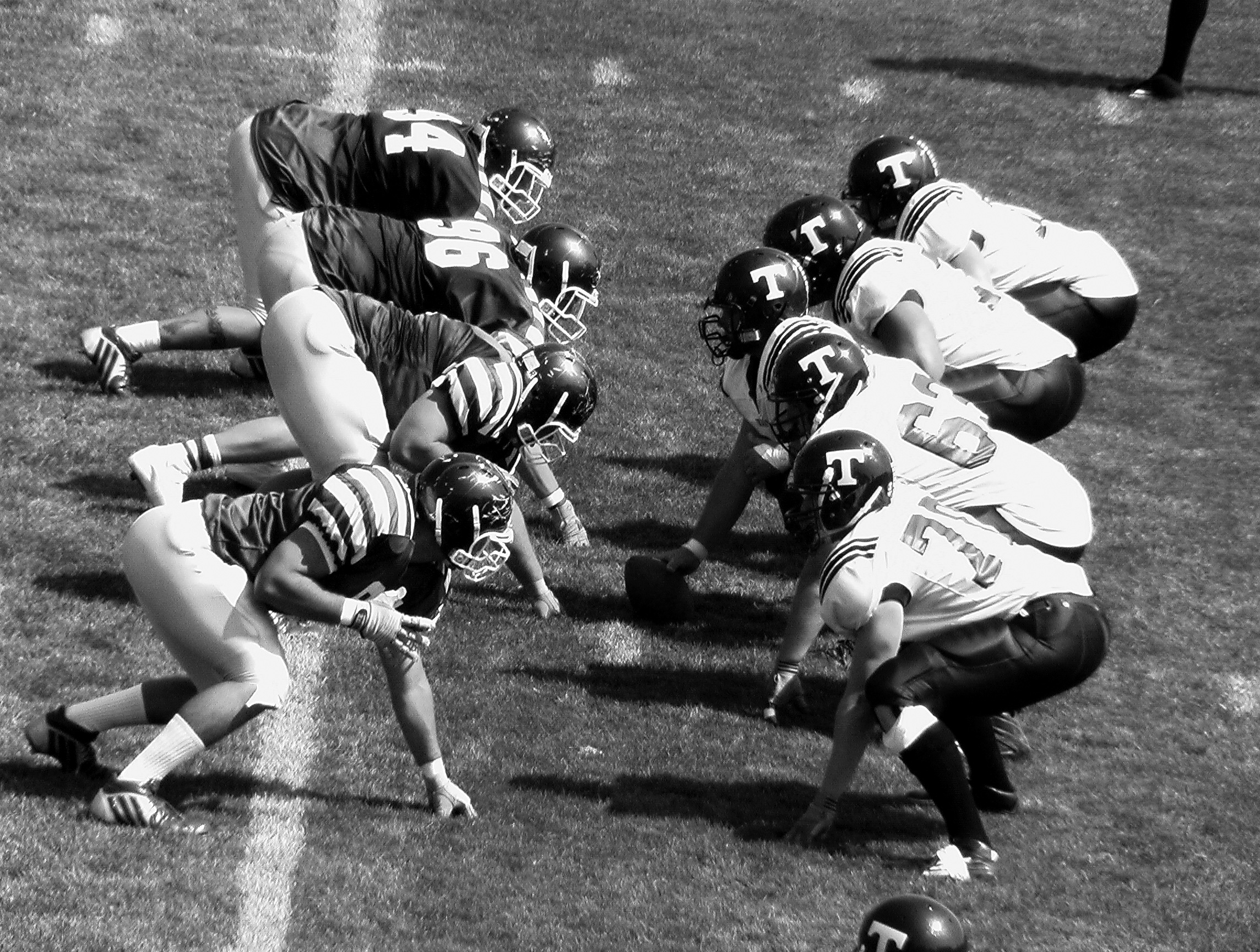 black and white photo of football players on the field playing a game of football. As Super Bowl XVI nears, we look at how the sports betting industry has changed in the year and why this year's big game could be biggest in history.
