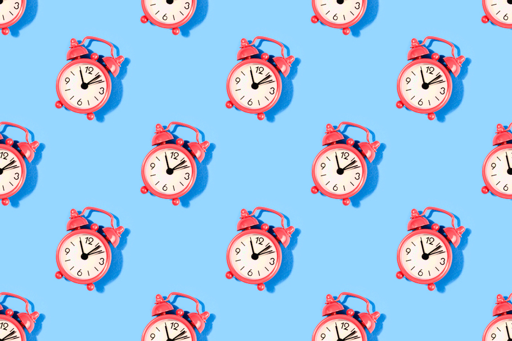 Retro red alarm clocks are seen on a blue background in a repeating pattern. Time is Almost Up for Kentucky Online Poker & Sports Betting Bill. Its fate could be decided by a single vote.